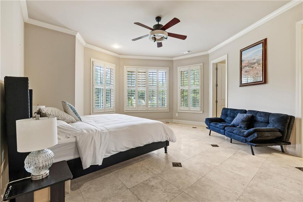 2267 Echo Trail Northeast Atlanta, GA 30345 - Photo 60 of 78 a spacious bedroom with a bed and a couch
