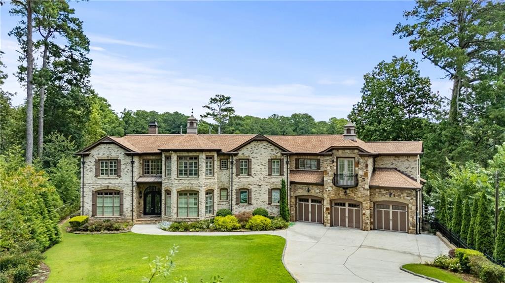 2267 Echo Trail Northeast Atlanta, GA 30345 - Photo 72 of 78 a front view of a residential houses with yard and green space