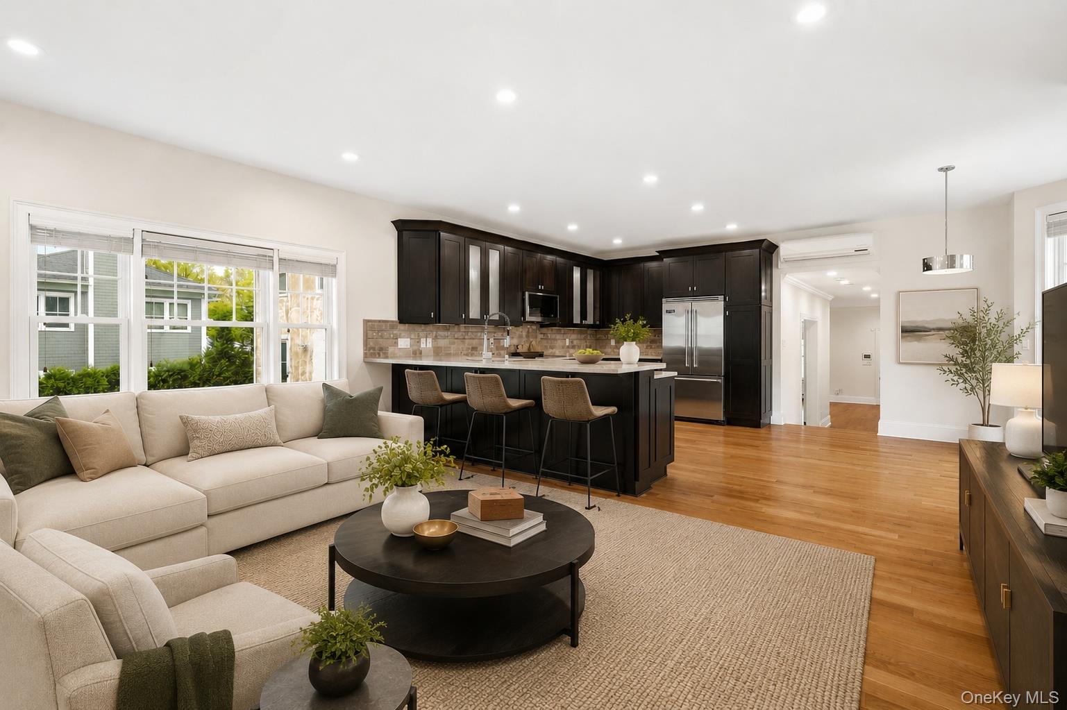 228 Central Avenue Rye, NY 10580 - Photo 7 of 24 a living room with furniture and a kitchen view