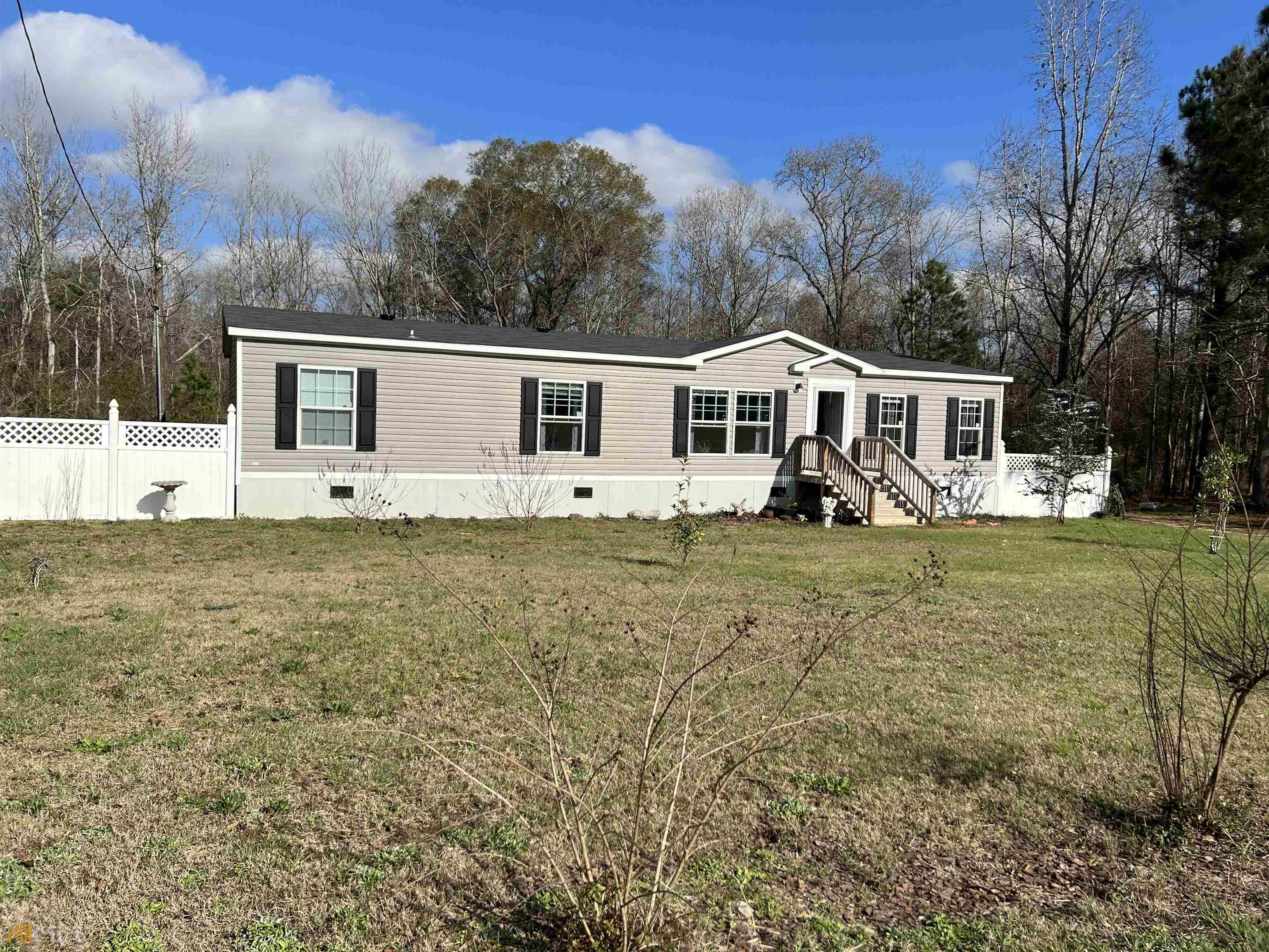 1998 Carters Bridge Road Claxton, GA 30417 - Photo 1 of 1 a front view of a house with garden