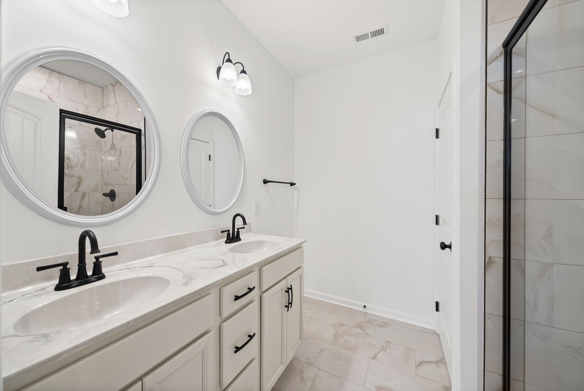 612 Hill Road Clarksville, TN 37040 - Photo 20 of 44 a bathroom with a double vanity sink and a mirror