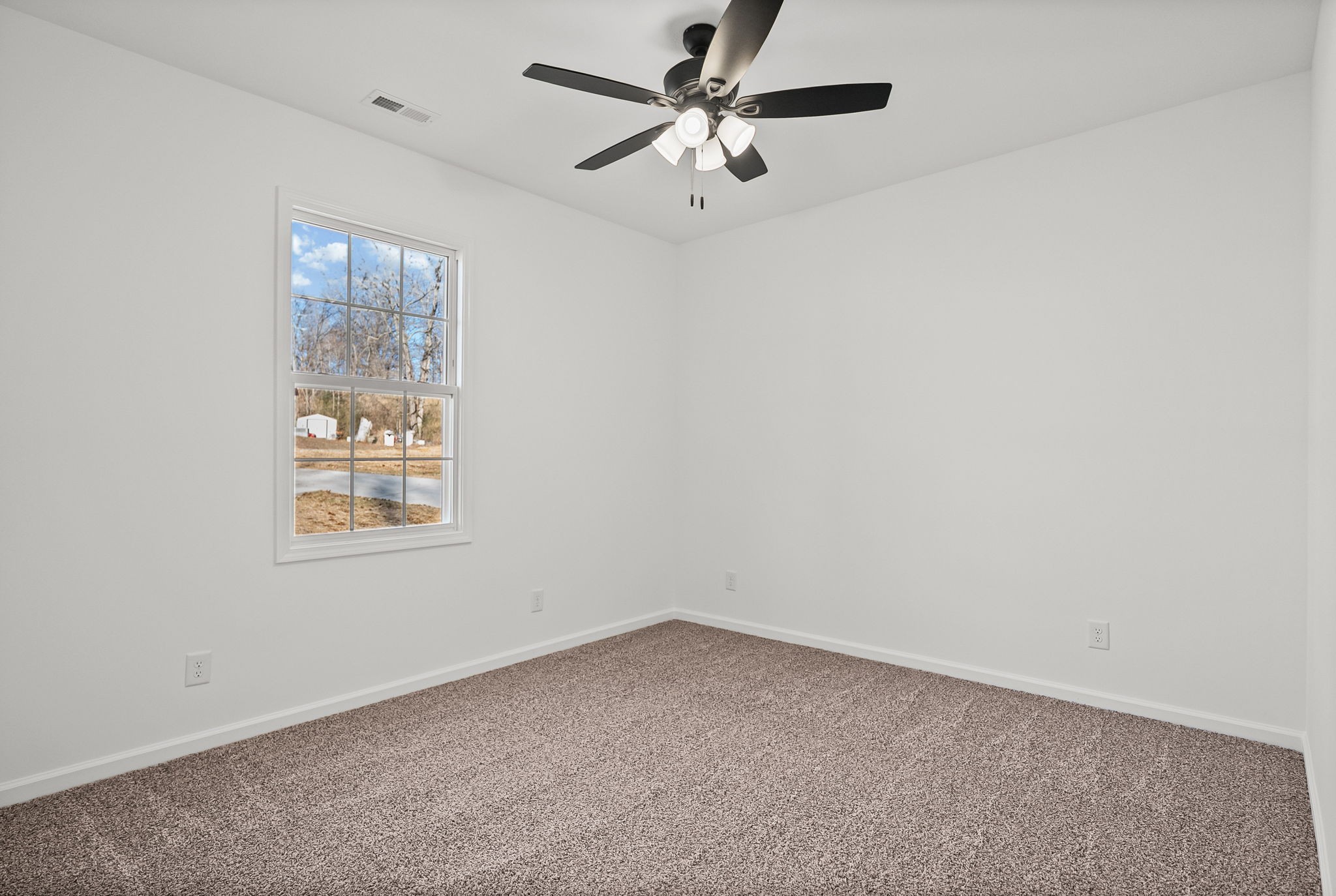 612 Hill Road Clarksville, TN 37040 - Photo 23 of 44 an empty room with a window and a fan