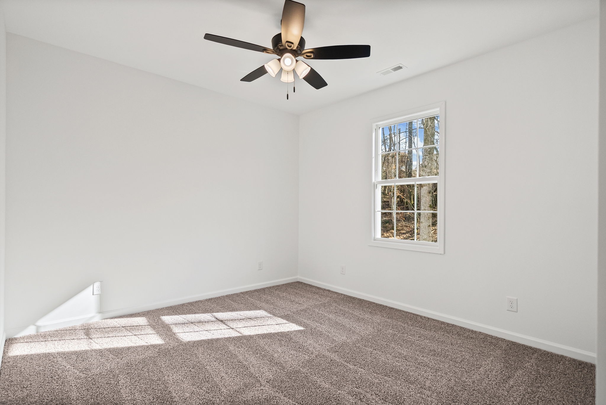 612 Hill Road Clarksville, TN 37040 - Photo 27 of 44 an empty room with a window and a ceiling fan