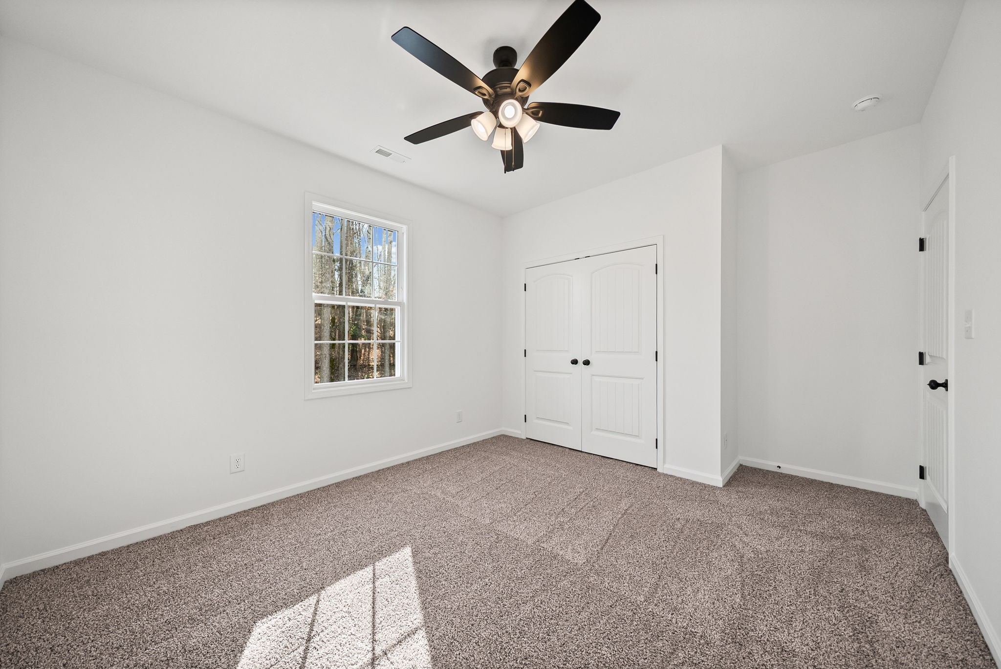 612 Hill Road Clarksville, TN 37040 - Photo 28 of 44 a view of an empty room with window and a ceiling fan