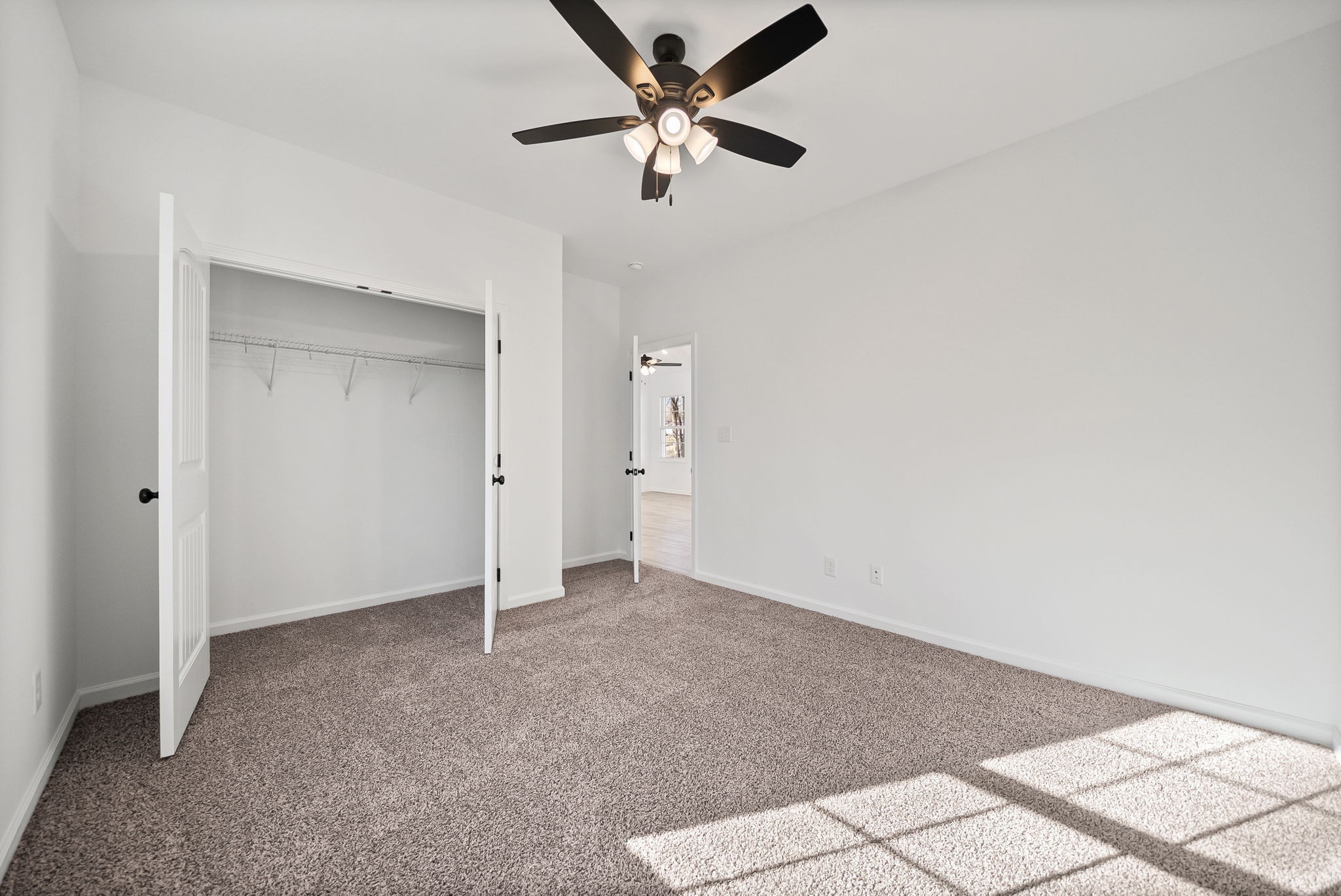 612 Hill Road Clarksville, TN 37040 - Photo 29 of 44 an empty room with closet and a chandelier fan