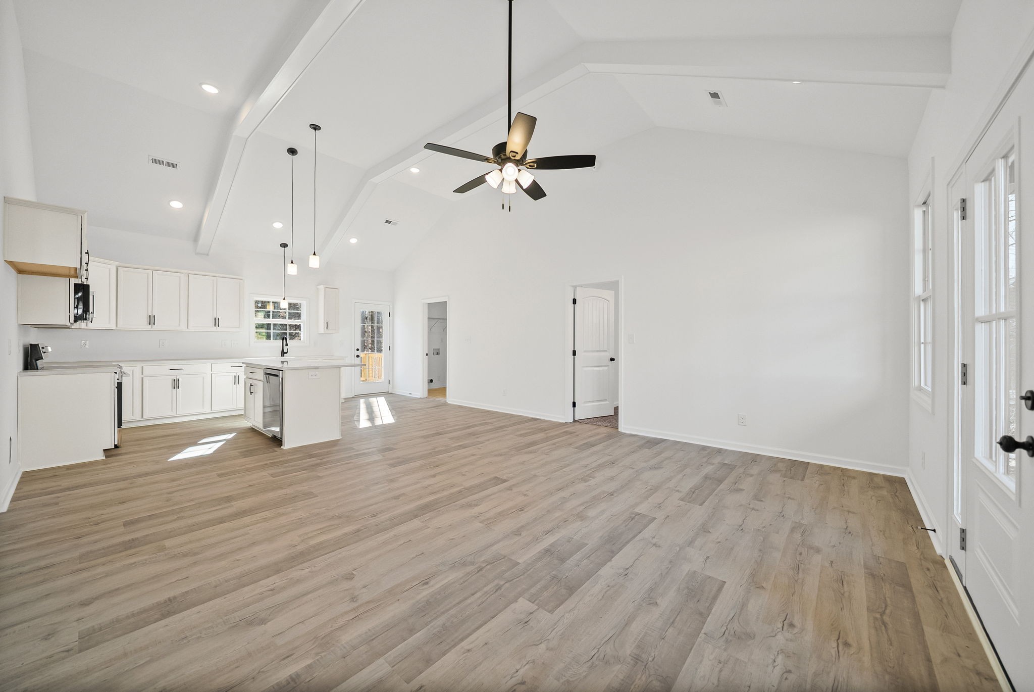 612 Hill Road Clarksville, TN 37040 - Photo 8 of 44 a view of a kitchen with an empty space and a ceiling fan