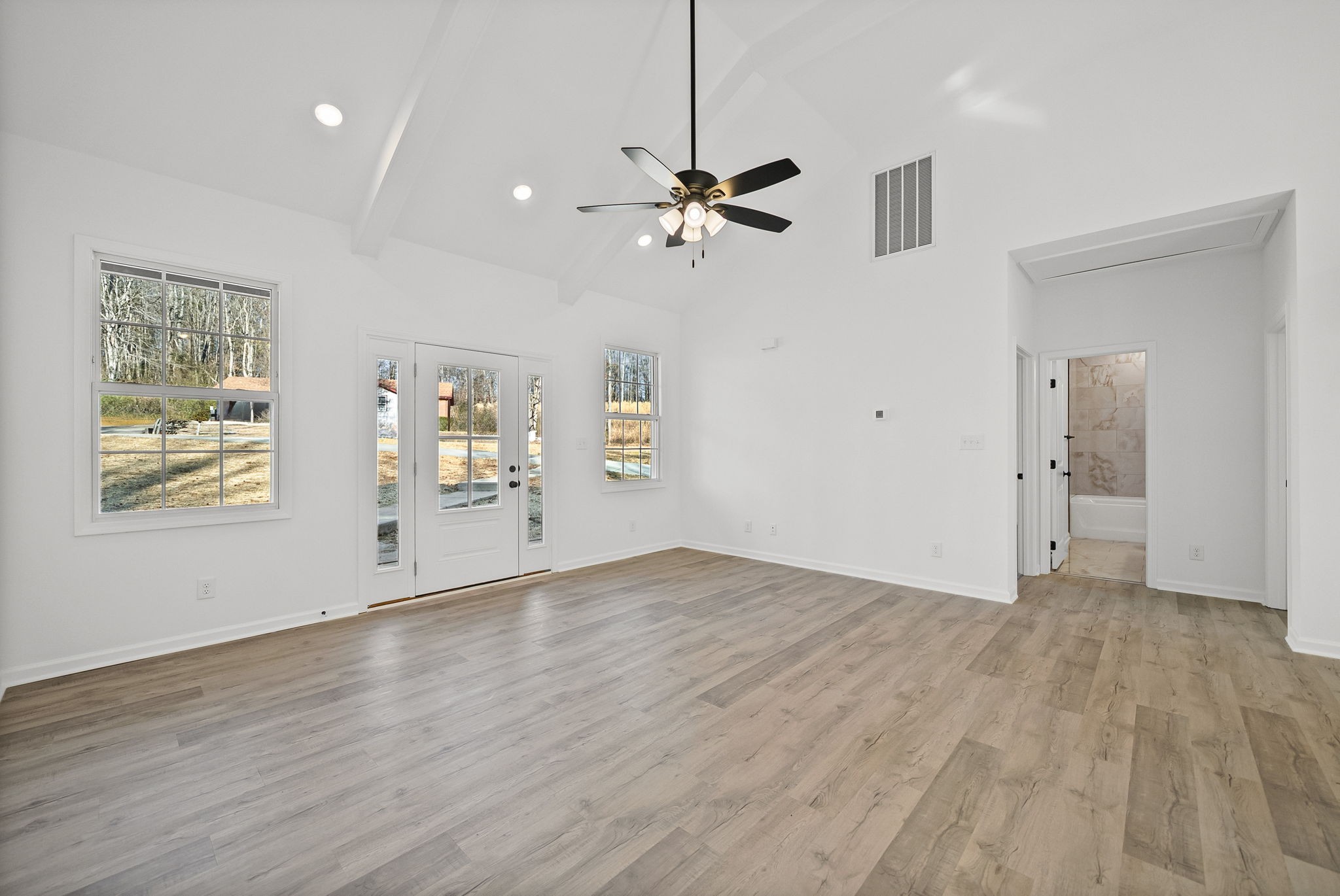 612 Hill Road Clarksville, TN 37040 - Photo 9 of 44 wooden floor in an empty room with a window