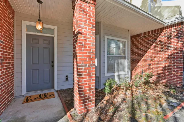 a view of living room with furniture and potted plant