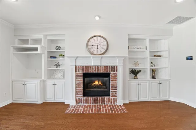 a living room with furniture a clock and a fireplace