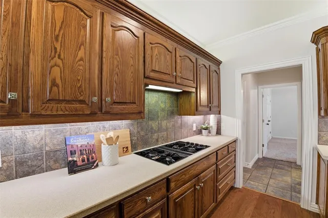 a kitchen with a stove and a sink