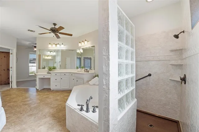 a bathroom with a bathtub sink and view
