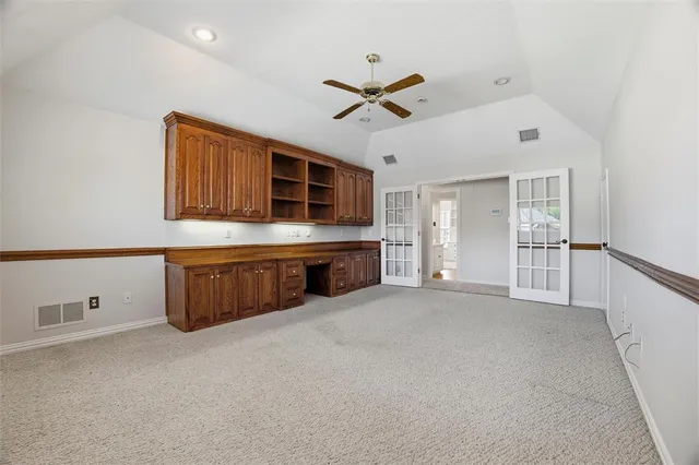 a living room with stainless steel appliances kitchen island granite countertop a sink cabinets and window