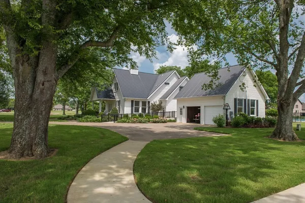 front view of a house with a yard