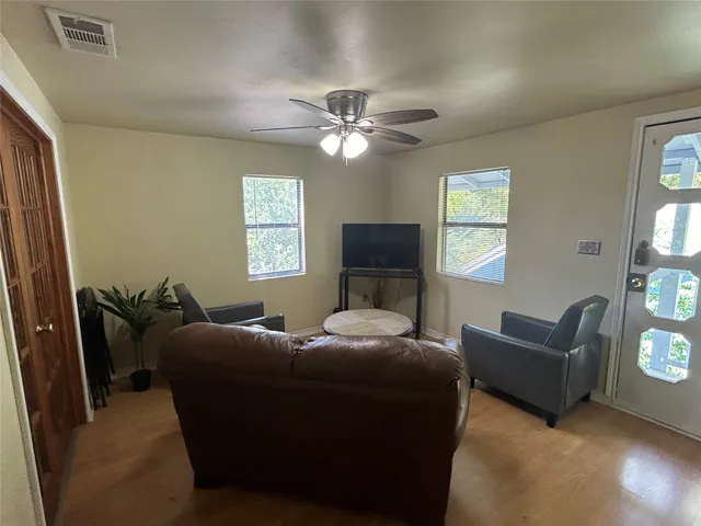 a bedroom with furniture and a window