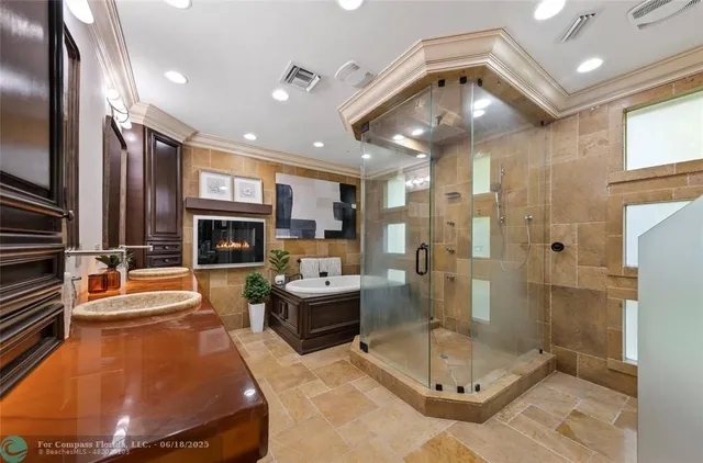 a bathroom with a granite countertop sink a toilet and mirror