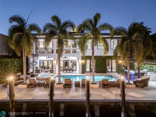 a front view of a house with outdoor seating