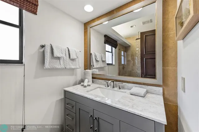 a bathroom with a bathtub and shower
