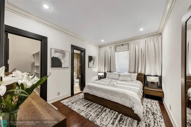 a lobby with furniture and a potted plant