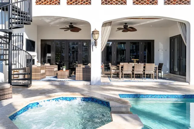a view of a backyard with a swimming pool
