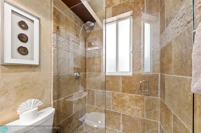 a view of a patio with a dining table and chairs