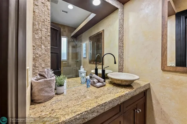 a view of a patio with a table and chairs