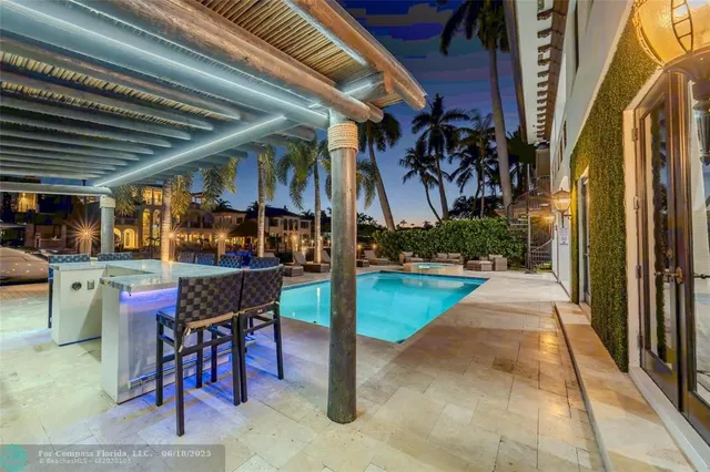 a view of a patio with couches and table potted plants