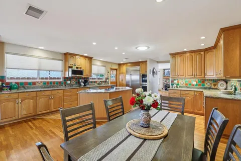 a dining room with furniture and window