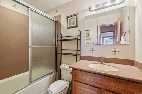 a bedroom with a bed and a dresser in it