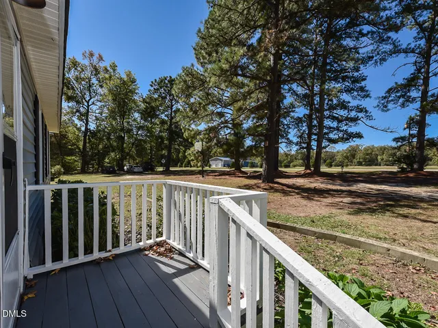 a view of a balcony with wooden floor