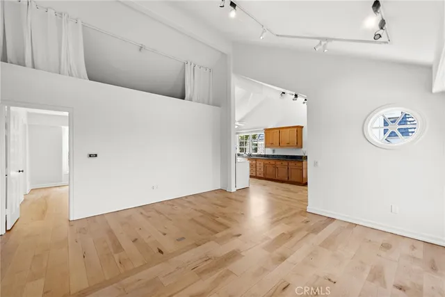 en empty room with windows and stairs