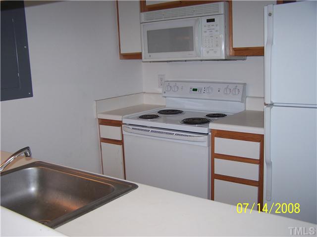 1241 University Court, Unit 304 Raleigh, NC 27606 - Photo 2 of 4 a utility room with dryer and washer