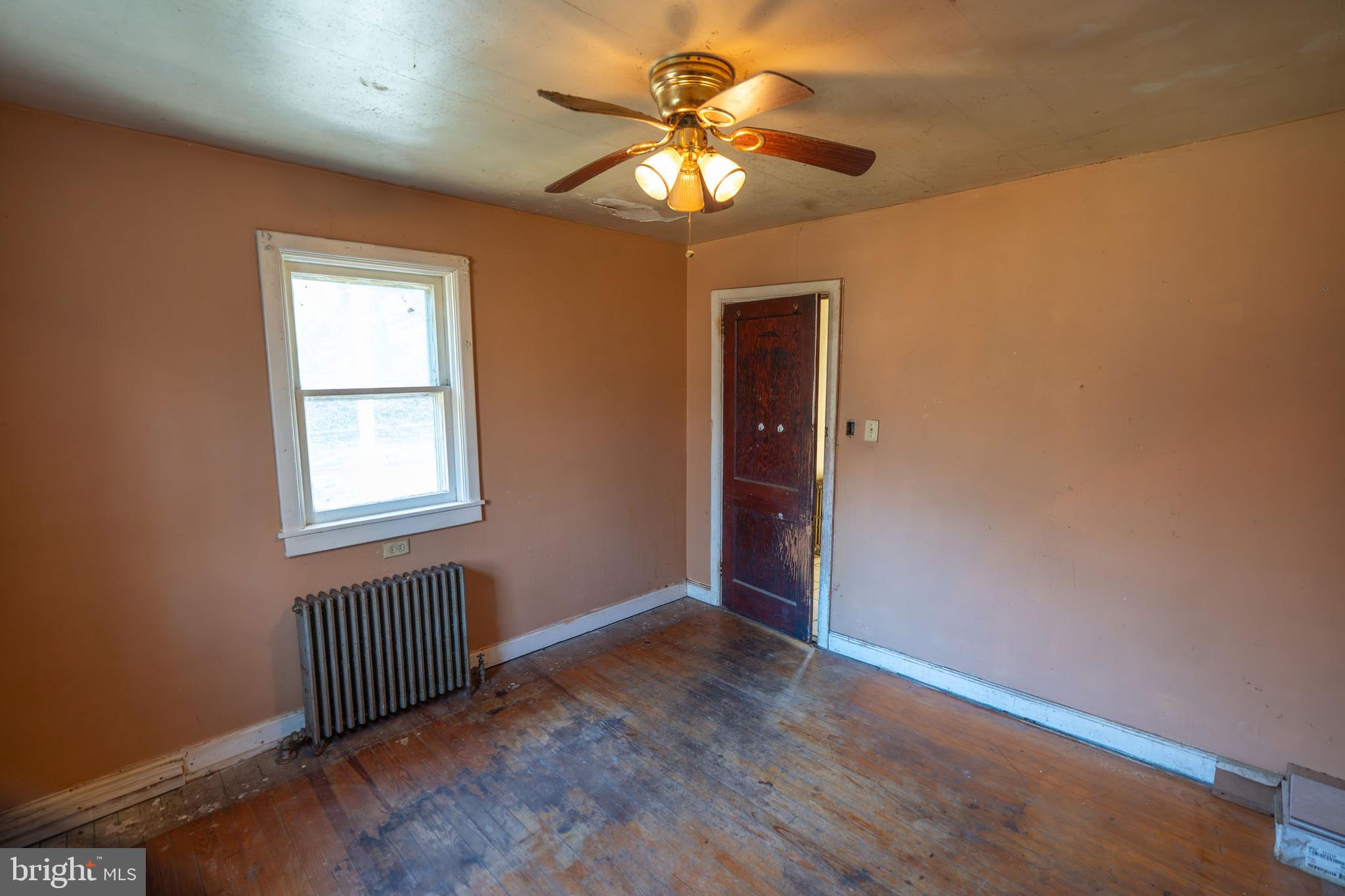 142 River Road Pequea, PA 17565 - Photo 22 of 35 an empty room with a chandelier fan and windows