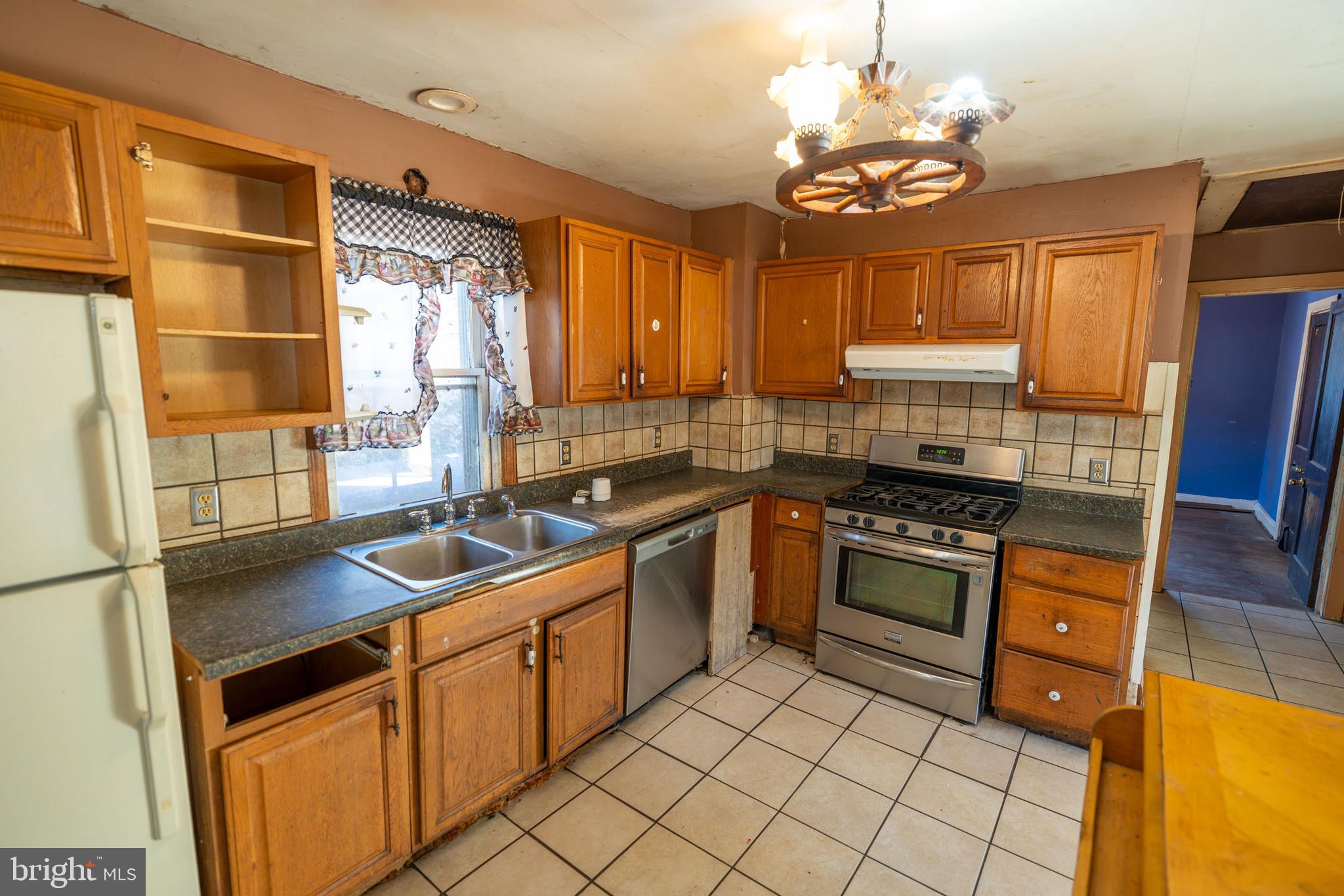 142 River Road Pequea, PA 17565 - Photo 4 of 35 a kitchen with stainless steel appliances granite countertop a sink stove and refrigerator