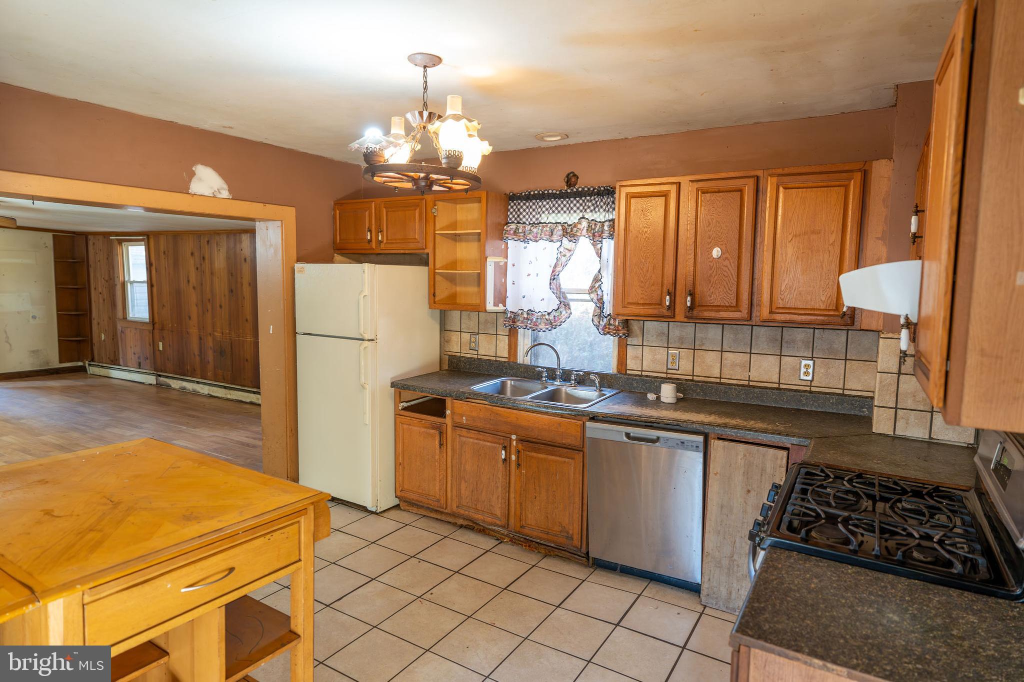 142 River Road Pequea, PA 17565 - Photo 9 of 35 a kitchen with stainless steel appliances granite countertop a sink and cabinets