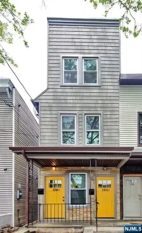 a view of a brick building with large windows