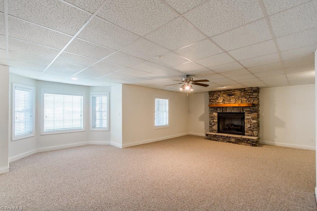 8315 Dennis Road Walnut Cove, NC 27052 - Photo 23 of 30 Bonus Room in Basement w/Stone Propane Fireplace & Bay Window
