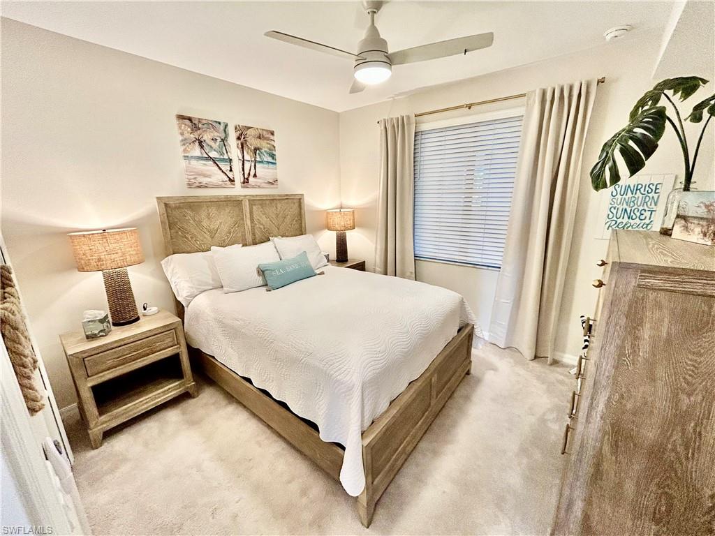 43989 Boardwalk Loop, Unit 2024 Babcock Ranch, FL 33982 - Photo 11 of 18 a bedroom with a bed and a couch