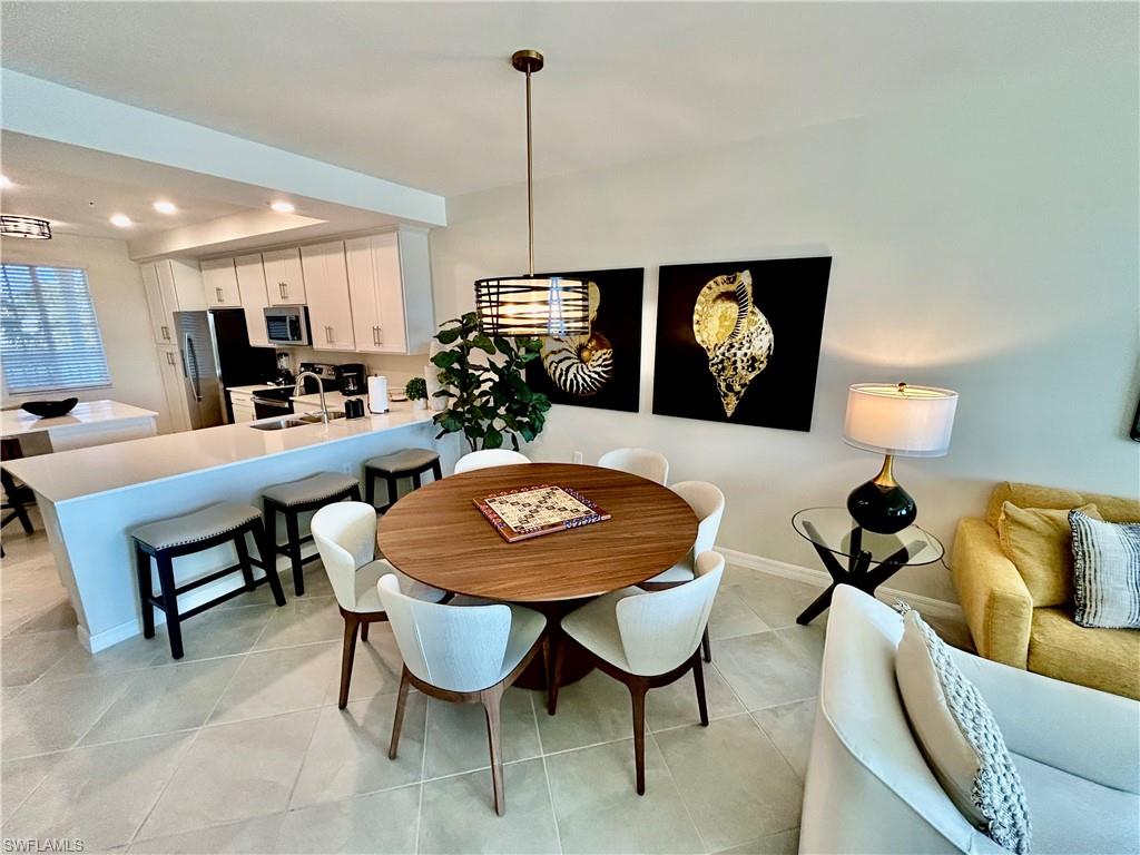 43989 Boardwalk Loop, Unit 2024 Babcock Ranch, FL 33982 - Photo 6 of 18 a view of a dining room with furniture