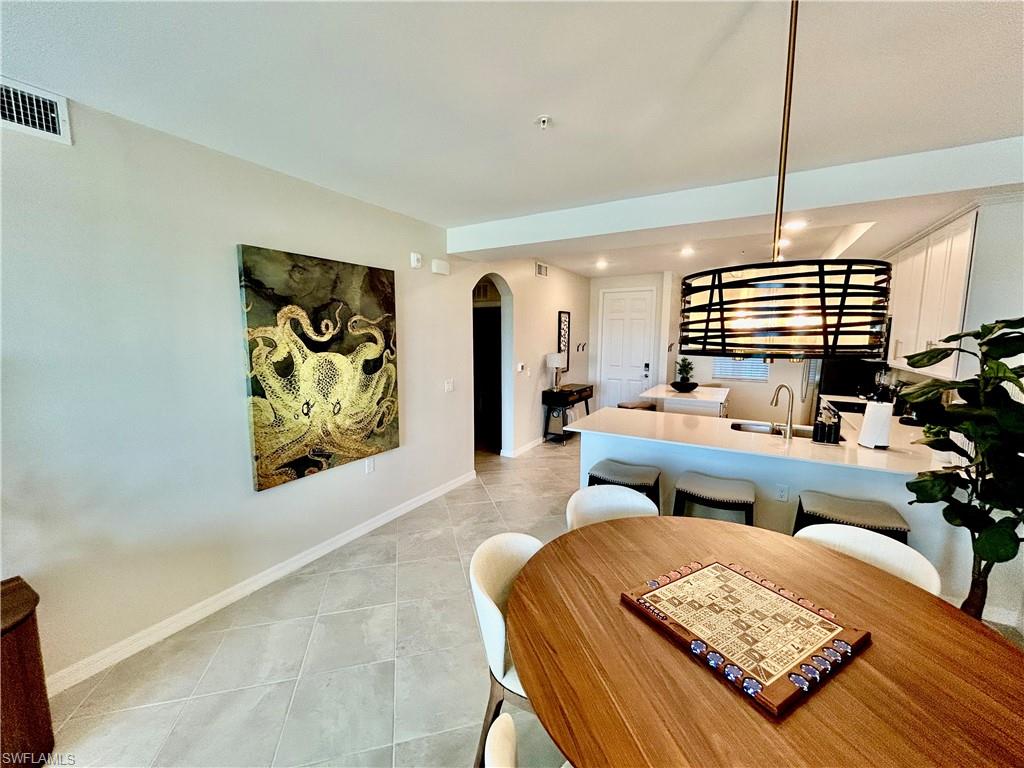 43989 Boardwalk Loop, Unit 2024 Babcock Ranch, FL 33982 - Photo 8 of 18 a living room with furniture and a couch