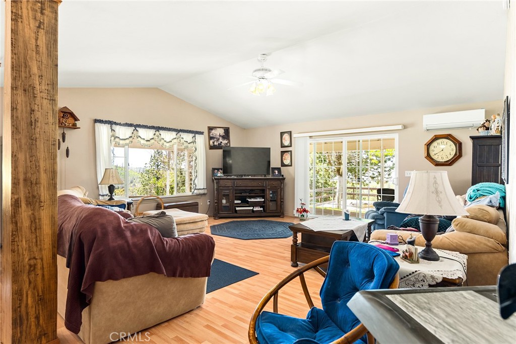 5735 Lunt Road Yankee Hill, CA 95965 - Photo 13 of 48 a living room with furniture and a flat screen tv