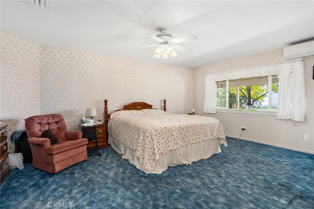 5735 Lunt Road Yankee Hill, CA 95965 - Photo 16 of 48 a bedroom with bed and window