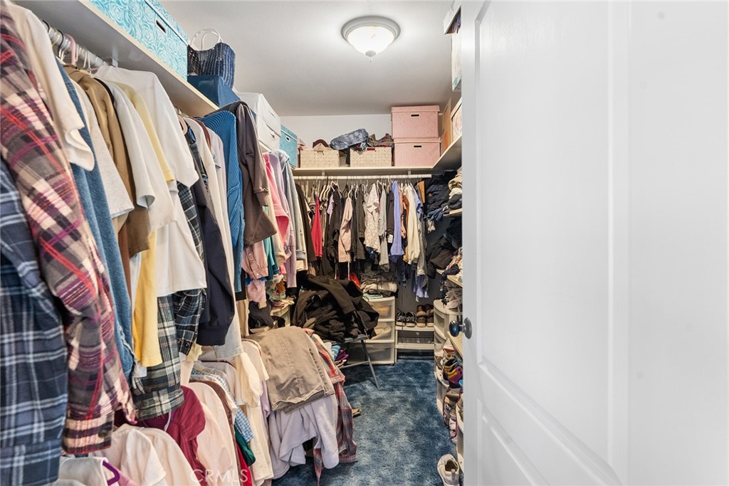 5735 Lunt Road Yankee Hill, CA 95965 - Photo 18 of 48 a view of walk in closet with clothes and shoes