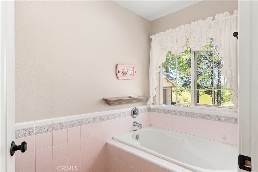 5735 Lunt Road Yankee Hill, CA 95965 - Photo 20 of 48 a white bath tub sitting next to a window