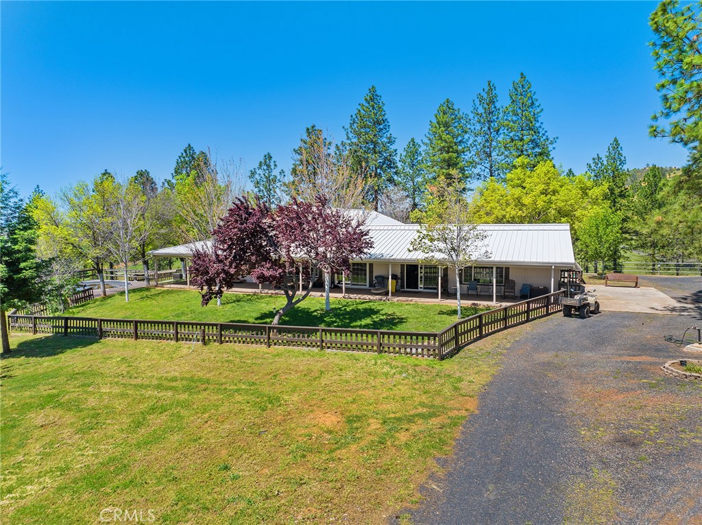 5735 Lunt Road Yankee Hill, CA 95965 - Photo 2 of 48 a view of a house with swimming pool and a yard