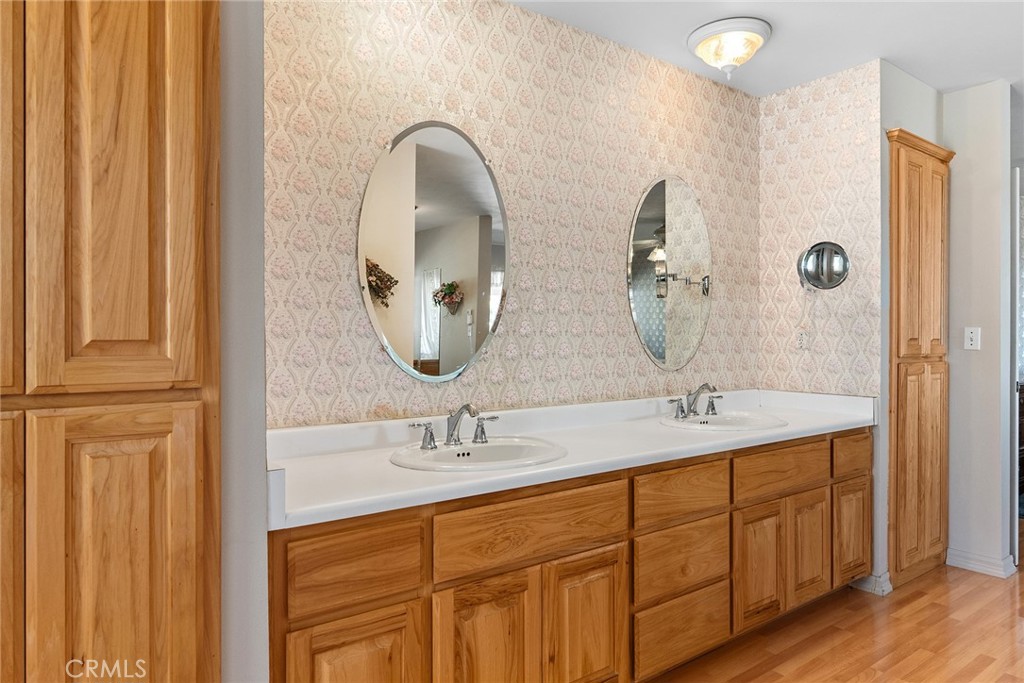 5735 Lunt Road Yankee Hill, CA 95965 - Photo 22 of 48 a bathroom with a granite countertop sink a mirror and vanity