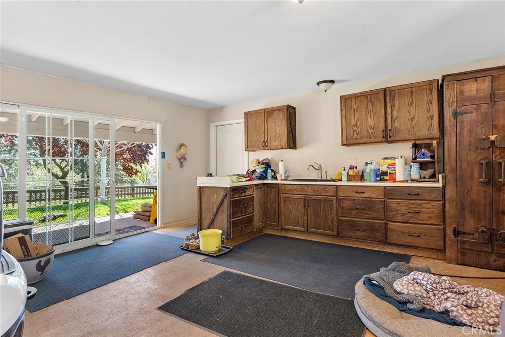 5735 Lunt Road Yankee Hill, CA 95965 - Photo 25 of 48 a bedroom with furniture and a large window