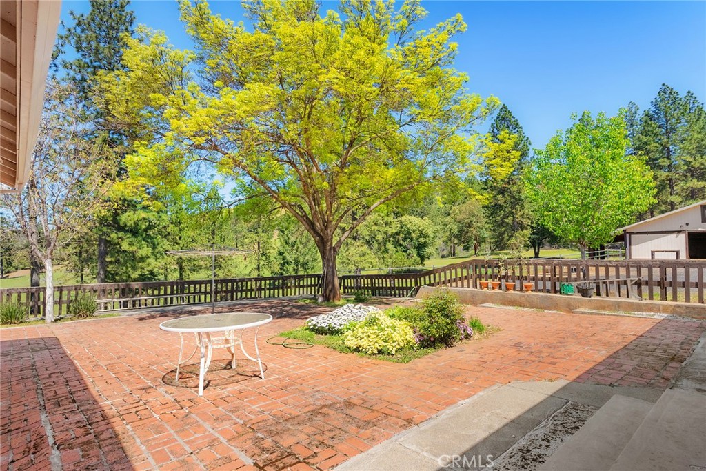 5735 Lunt Road Yankee Hill, CA 95965 - Photo 26 of 48 a view of a swimming pool with a patio