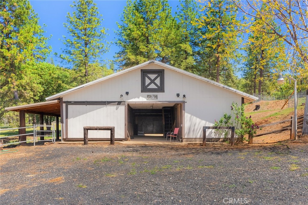 5735 Lunt Road Yankee Hill, CA 95965 - Photo 5 of 48 a view of an house with backyard space and parking