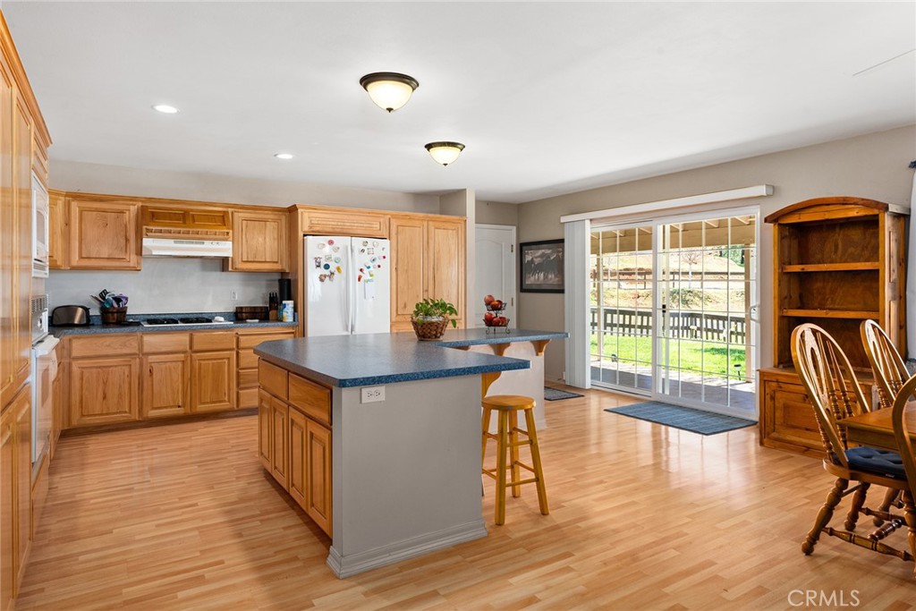 5735 Lunt Road Yankee Hill, CA 95965 - Photo 8 of 48 a kitchen with stainless steel appliances granite countertop a stove and a refrigerator