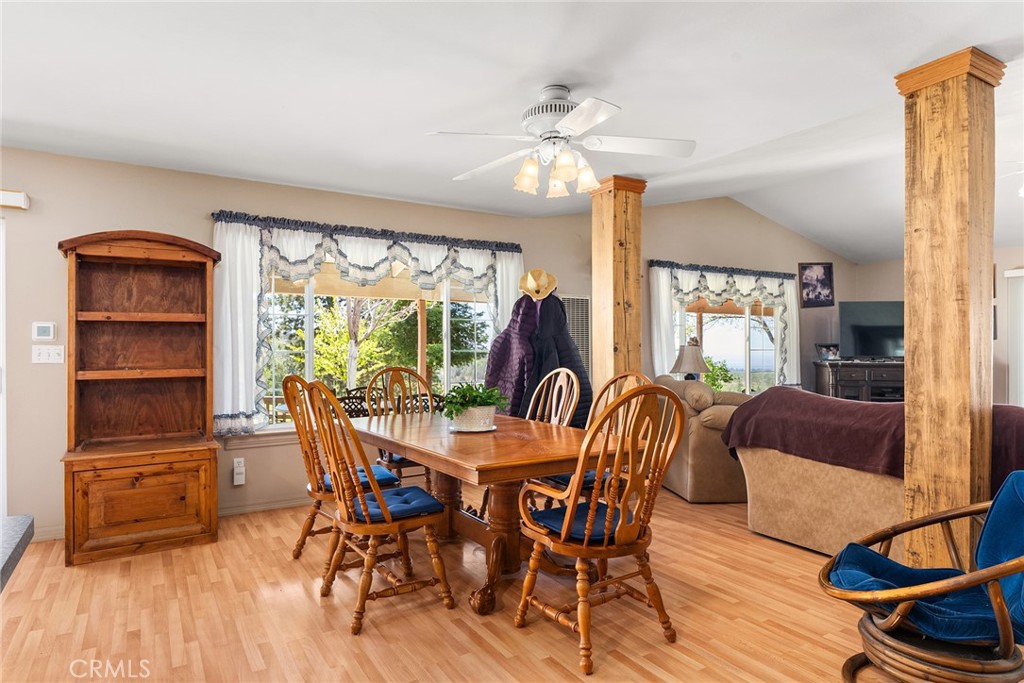 5735 Lunt Road Yankee Hill, CA 95965 - Photo 9 of 48 a view of a dining room with furniture window and wooden floor